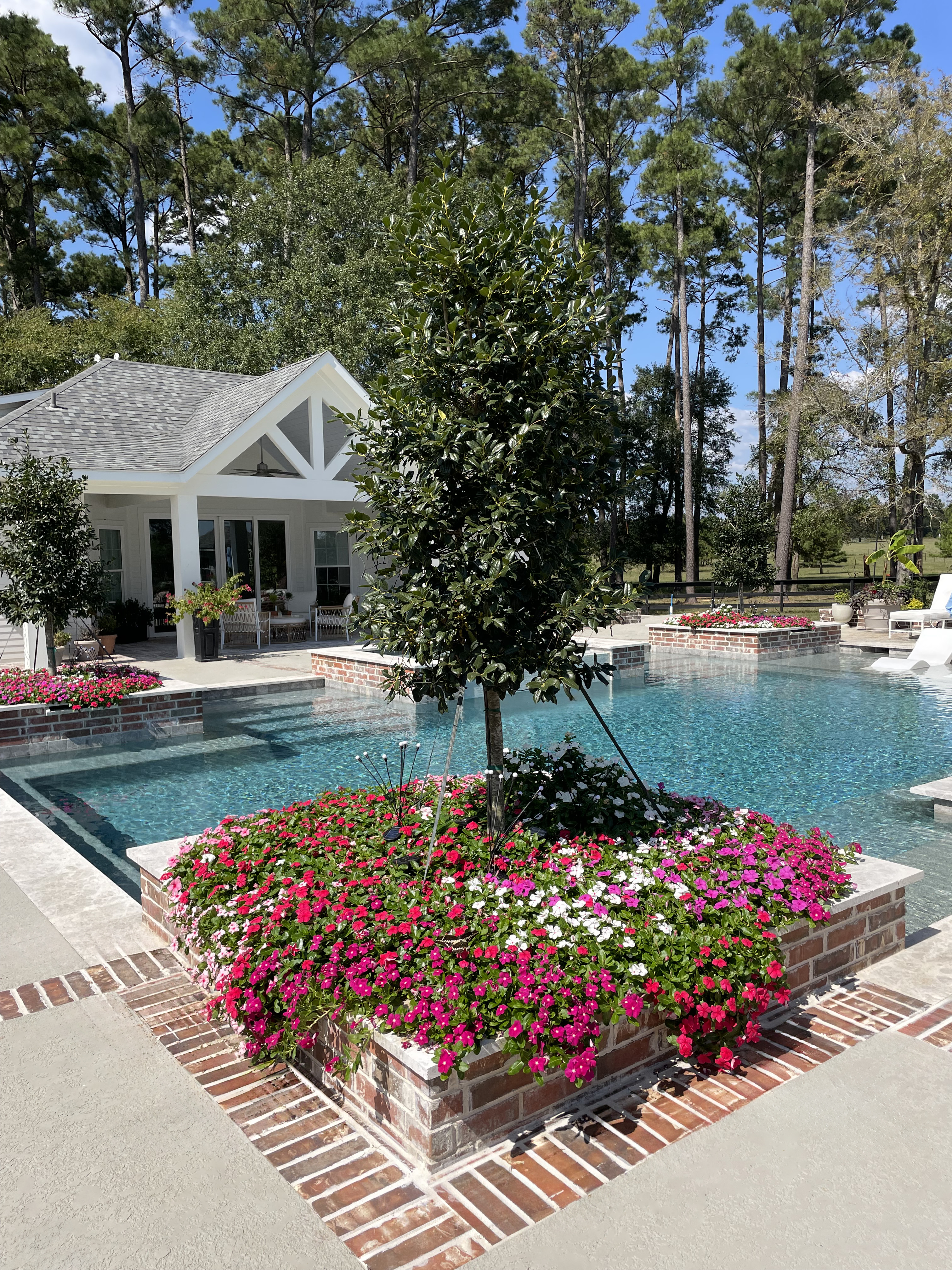 Pool landscaping and garden beds Magnolia TX — New Yards Landscaping